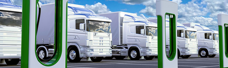 Wide angle digital rendering of EV trucks at charging station.