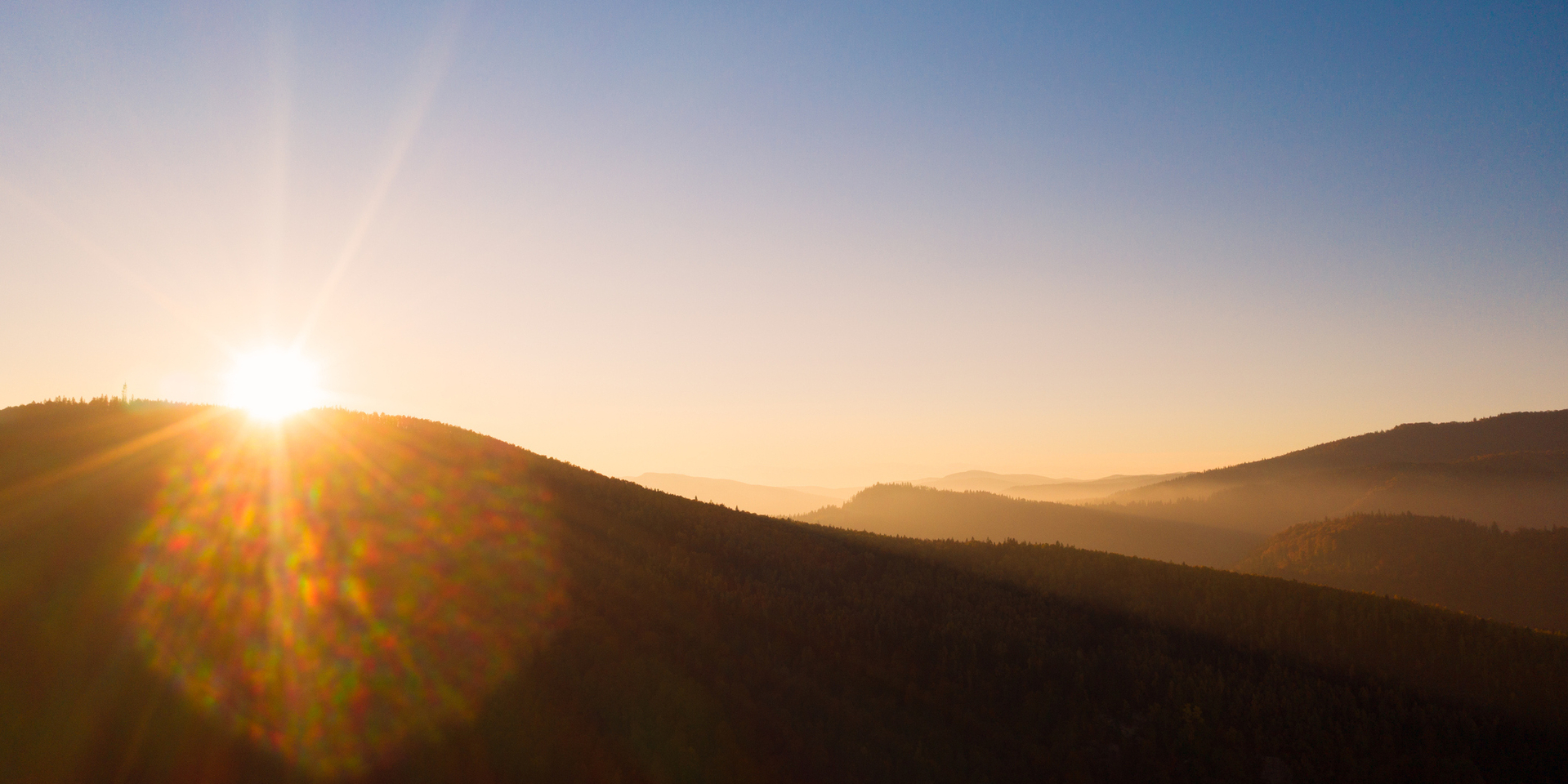 Scenic Aerial top view of colorful sunrise in the mountains in autumn