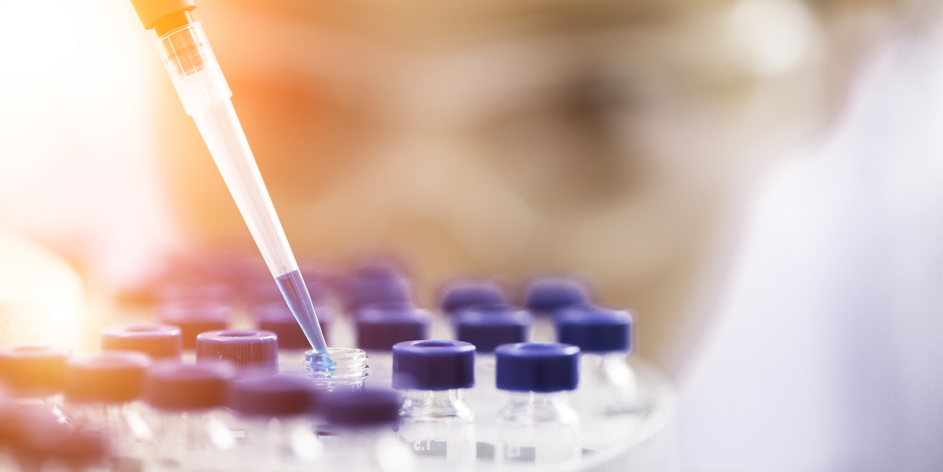 Female chemist at work in laboratory.