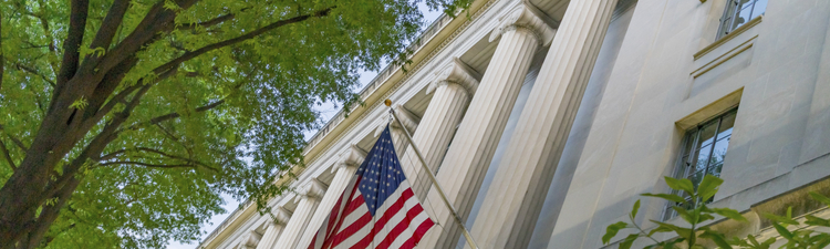 Facade Flags Justice Department Building Pennsylvania Avenue Washington DC Completed in 1935. Houses 1000s of lawyers working at Justice.