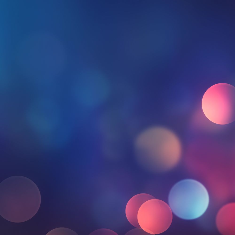 Medium angle of multicolored bokeh lights on purple background.