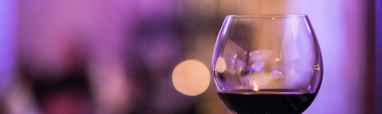 Close-up of red wine in wine glass. 
