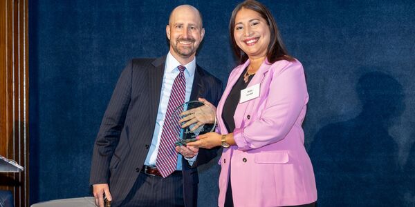 Latham partner Christopher Turner (left) accepted the award on the firm’s behalf. Photo courtesy of Volunteer Legal Advocates