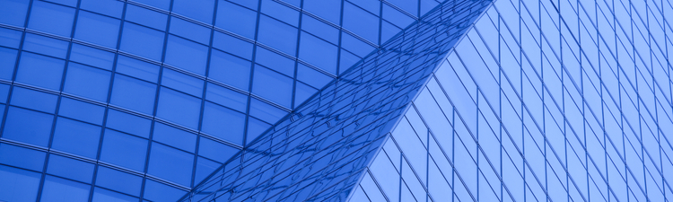 Close angle of curved architecture on glass buildling.