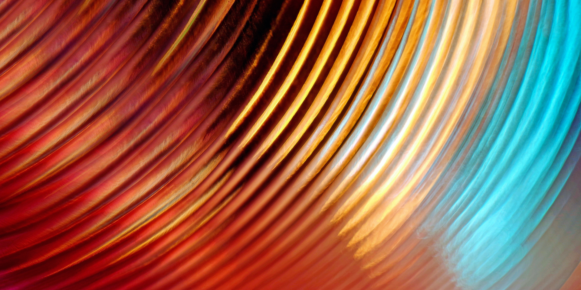 Arc-shaped copper colored light trails with blue tones
