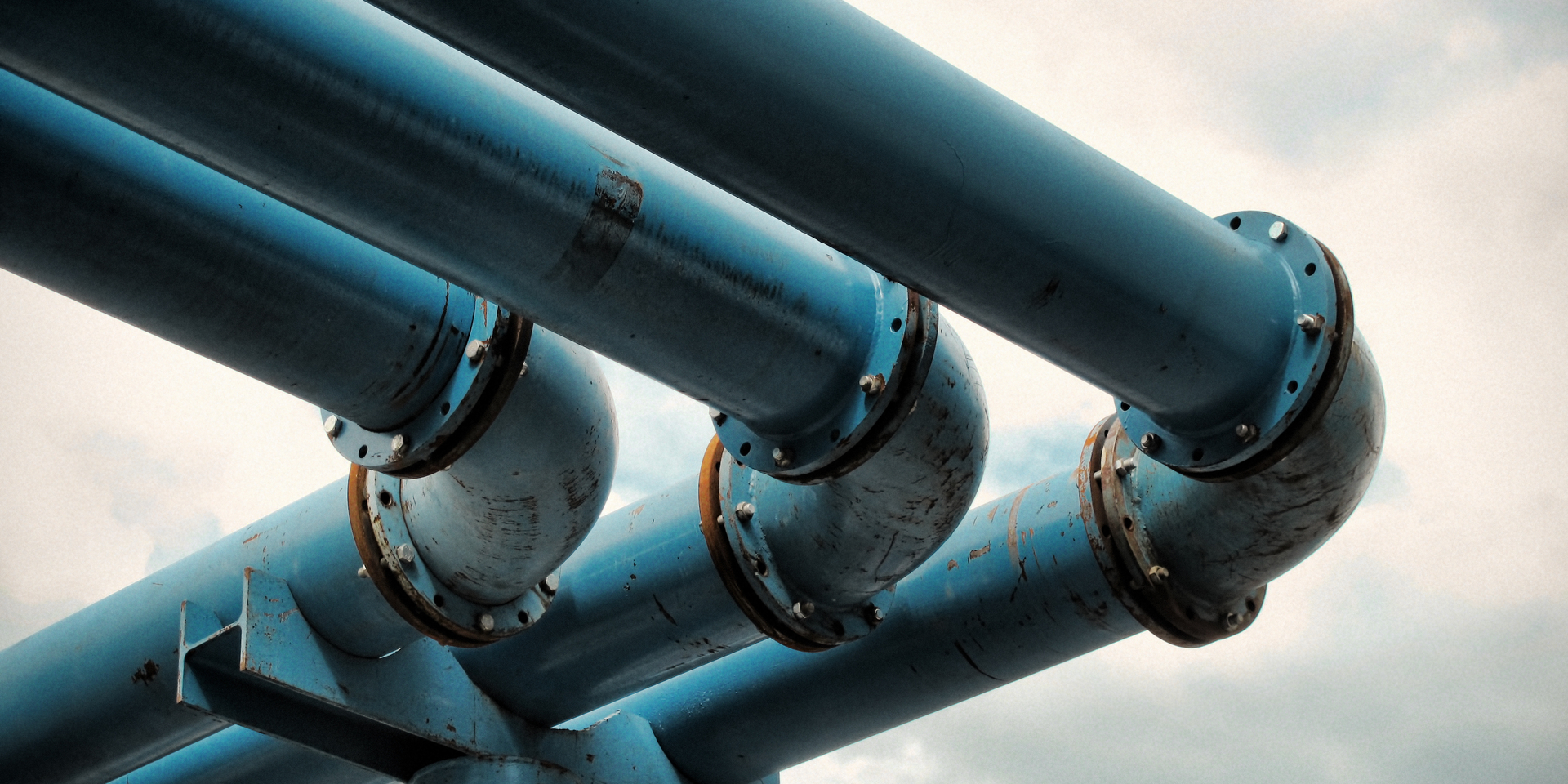 Detail of giant blue-colored water pipes, a peculiar system used to pump away ground-water from flooded foundations of construction sites.