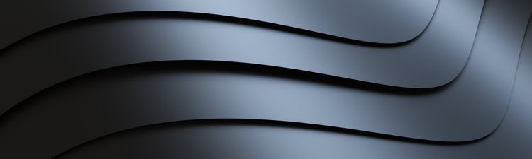 Close-up of digitally rendered, gray abstract background with curved lines.