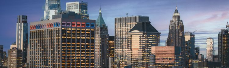 Medium angle Manhattan's Financial District at twilight.
