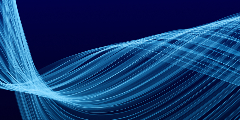 Blue abstract background composed of multiple soft lines.