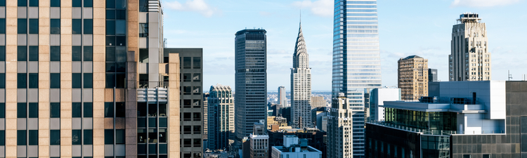 Medium angle of New York City skyline featuring Chrysler Building and One Vanderbilts skyscrapers.