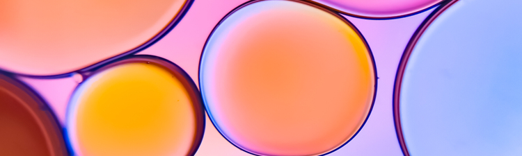 Close-up pink, orange, and purple liquid.