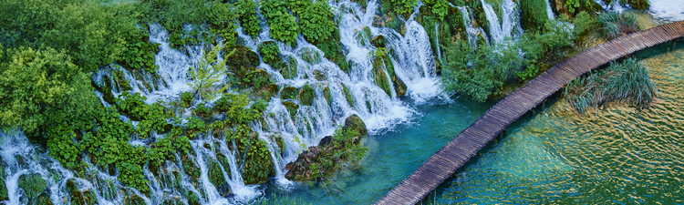 Aerial over wood boardwalk in Plitvice Lakes National Park, Croatia.