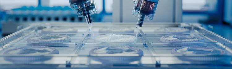 Close-up of medical printer machine producing artificial heart valves made from biopolymers.