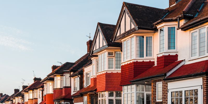 Medium angle of red and white row houses in England.