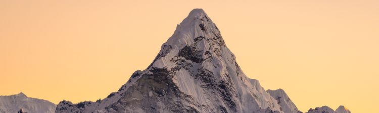 Wide angle of Ama Dablam mountain in Eastern Himalayas at sunrise.