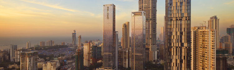 Wide angle of Mumbai, Maharashtra, India city skyline at sunset.