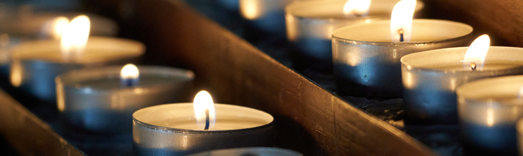 Close-up of lit tealight candles.