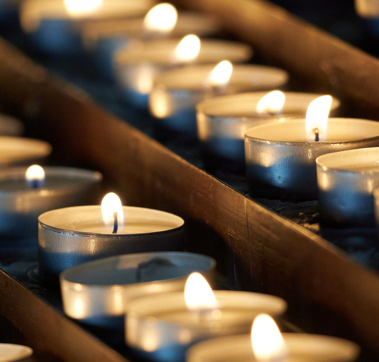 Close-up of lit tealight candles.