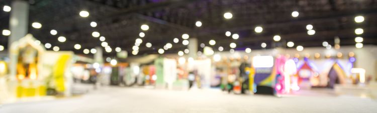 Medium angle of blurred exhibition event hall.