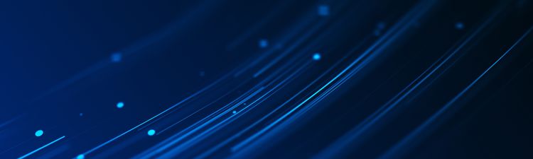 Medium angle of blue, curved light trails with glowing particles.