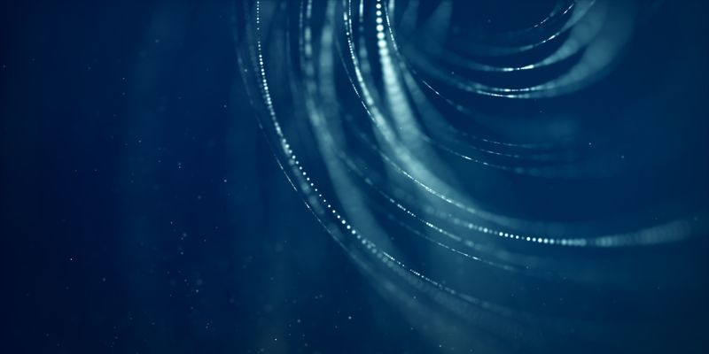 Medium angle of blue, curved light trails with glowing particles.