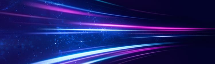 Medium angle of curved blue, purple, and magenta streaks of glowing light flowing across a dark background.