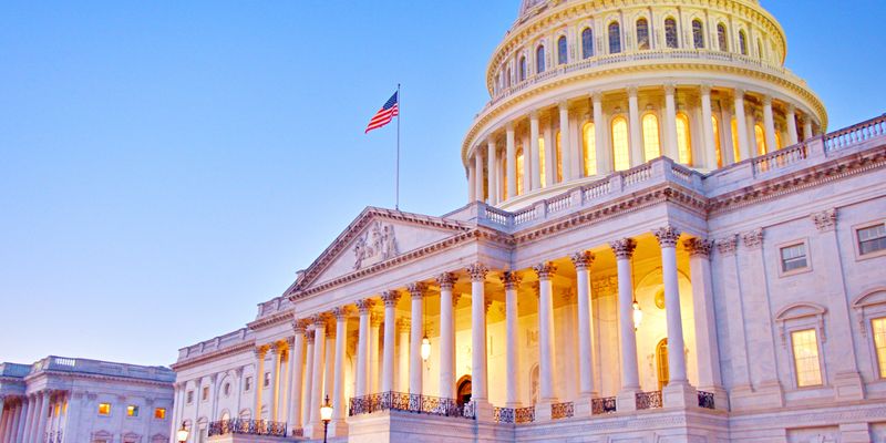 Medium angle of the East Front of The US Capitol Building at sunset.
