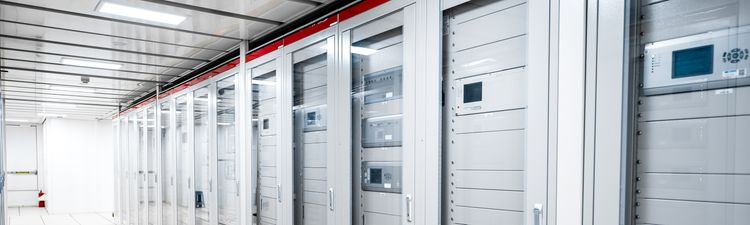 Medium angle of server racks in server room.
