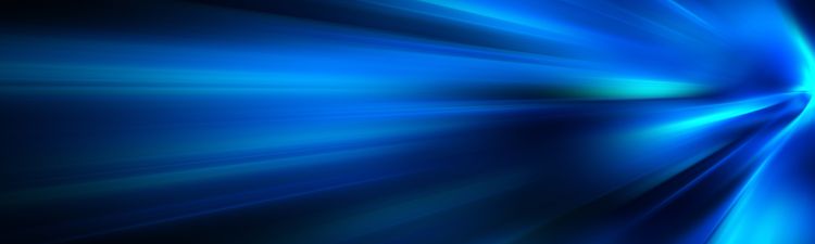 Close-up of blue abstract light trails on black background.