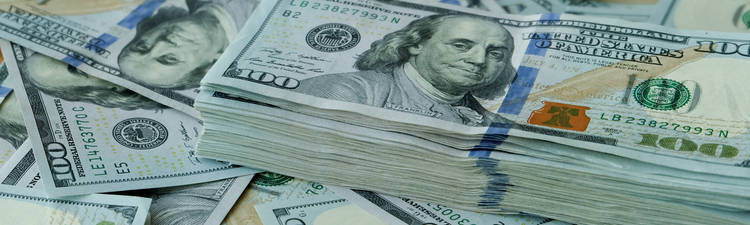Close-up of stacks of American $100 bills.