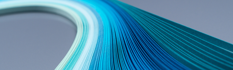 Curves of multi-colored paper stripes overhead view