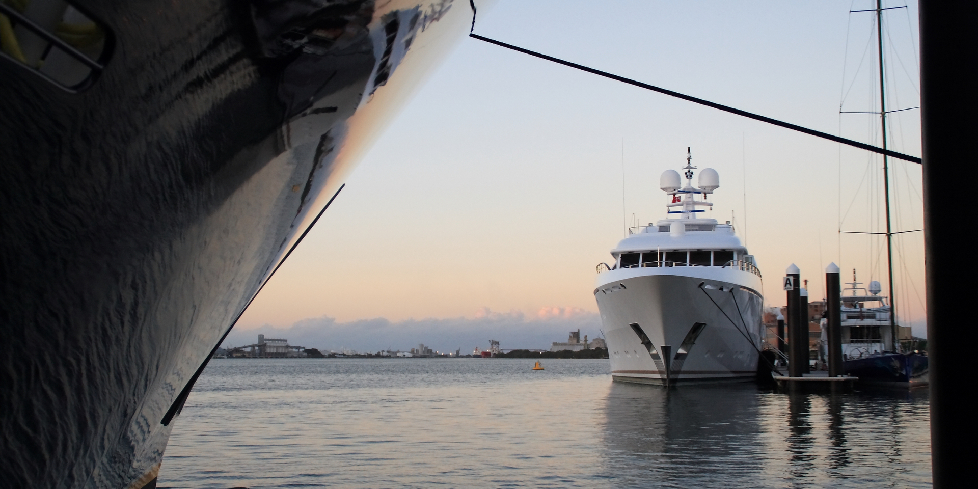 Two Super Yachts at Rivergate Marina, Brisbane Australia, with reflection of background yacht in bow of foreground yacht. Please see my other yacht bow photos... 