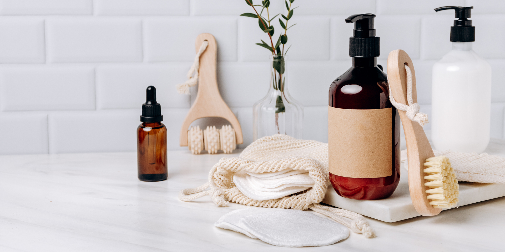 Close-up concept of skincare products on marble counter.
