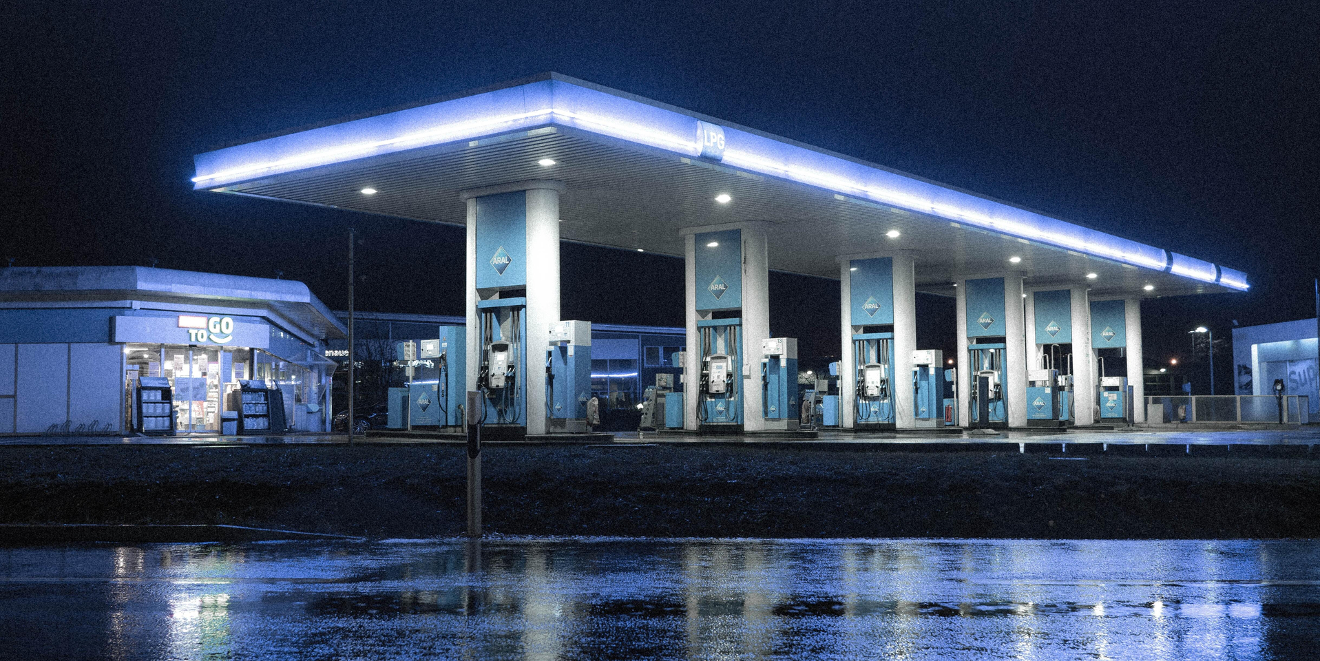 Wide angle of gas station at night.