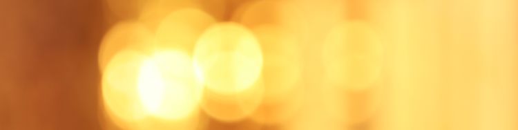Blurry vision of the sun reflected in the glass skyscraper.