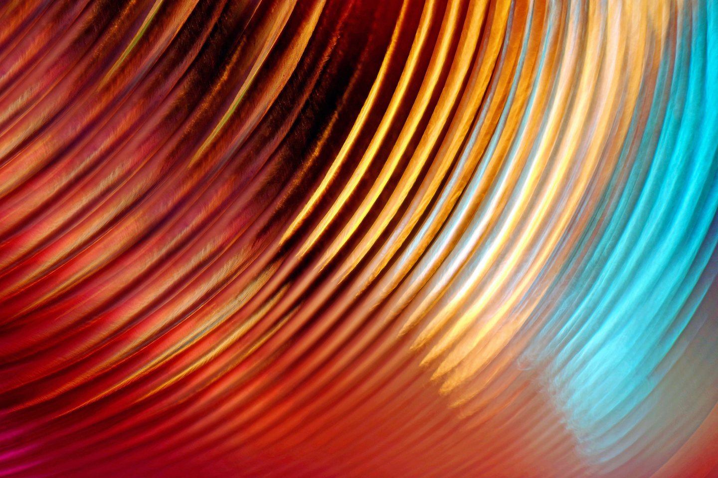 Arc-shaped copper colored light trails with blue tones