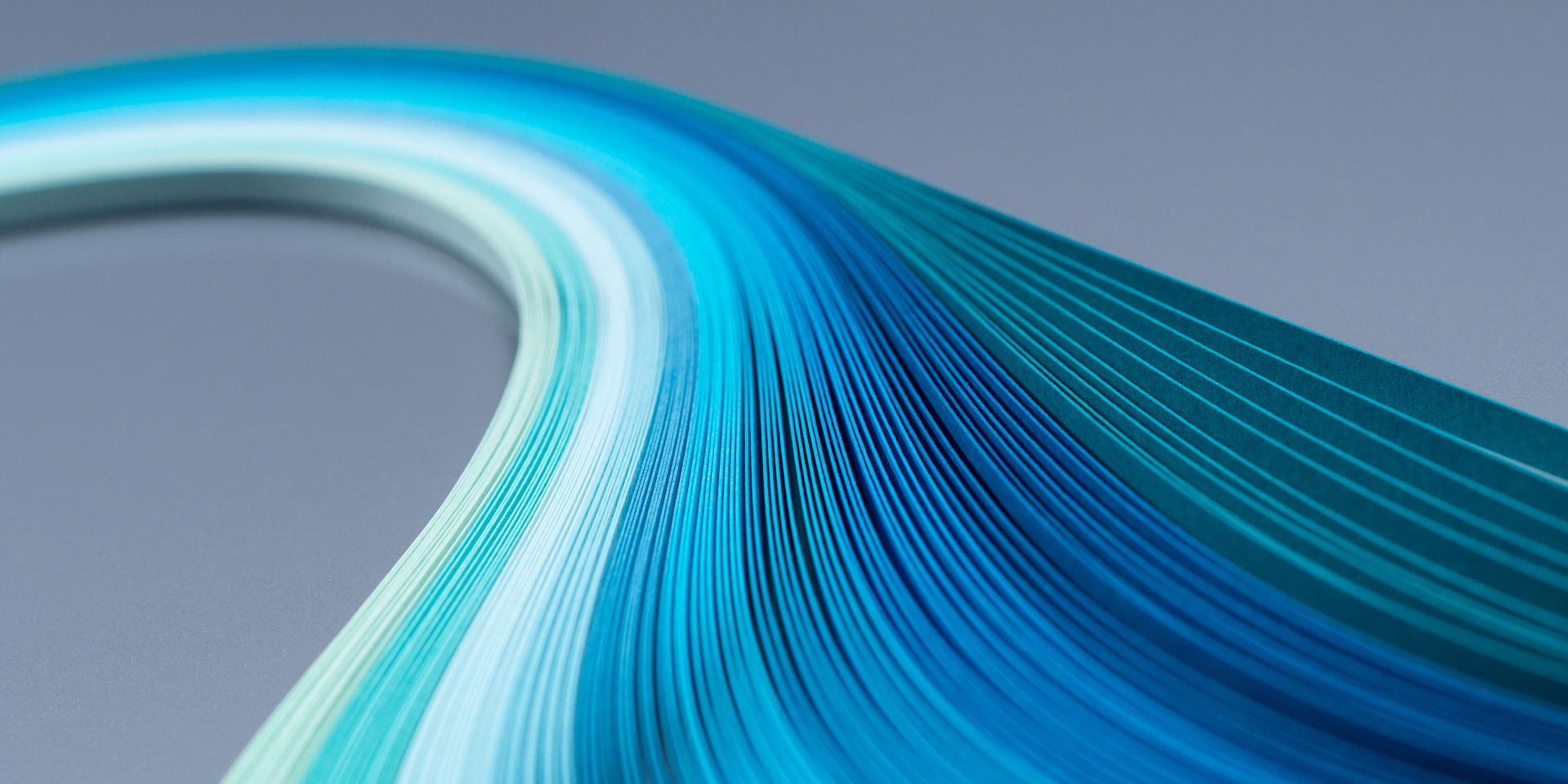 Curves of multi-colored paper stripes overhead view