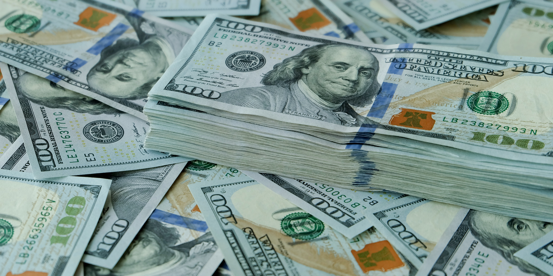 Close-up of stacks of American $100 bills.