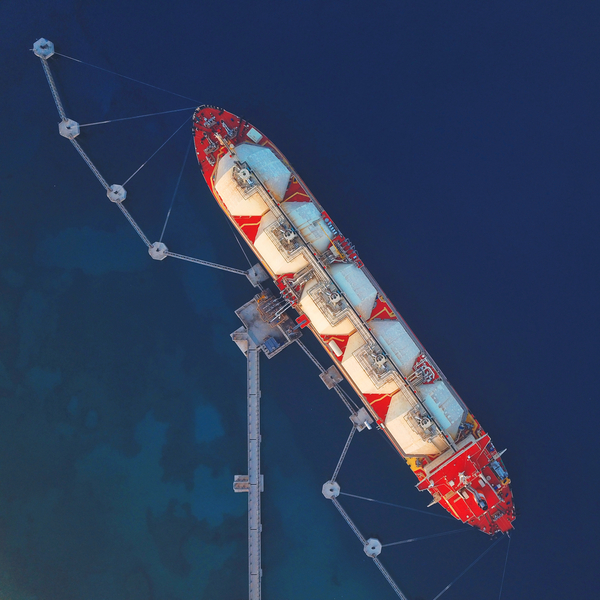 High angle view of an LNG Tanker moored to the jetty to supply Liquified Natural Gas to the Power Station.