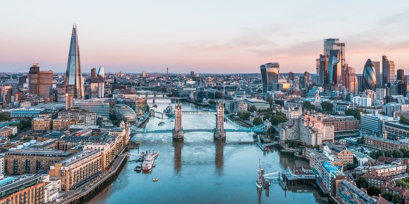 Wide angle of London city skyline at sunrise.