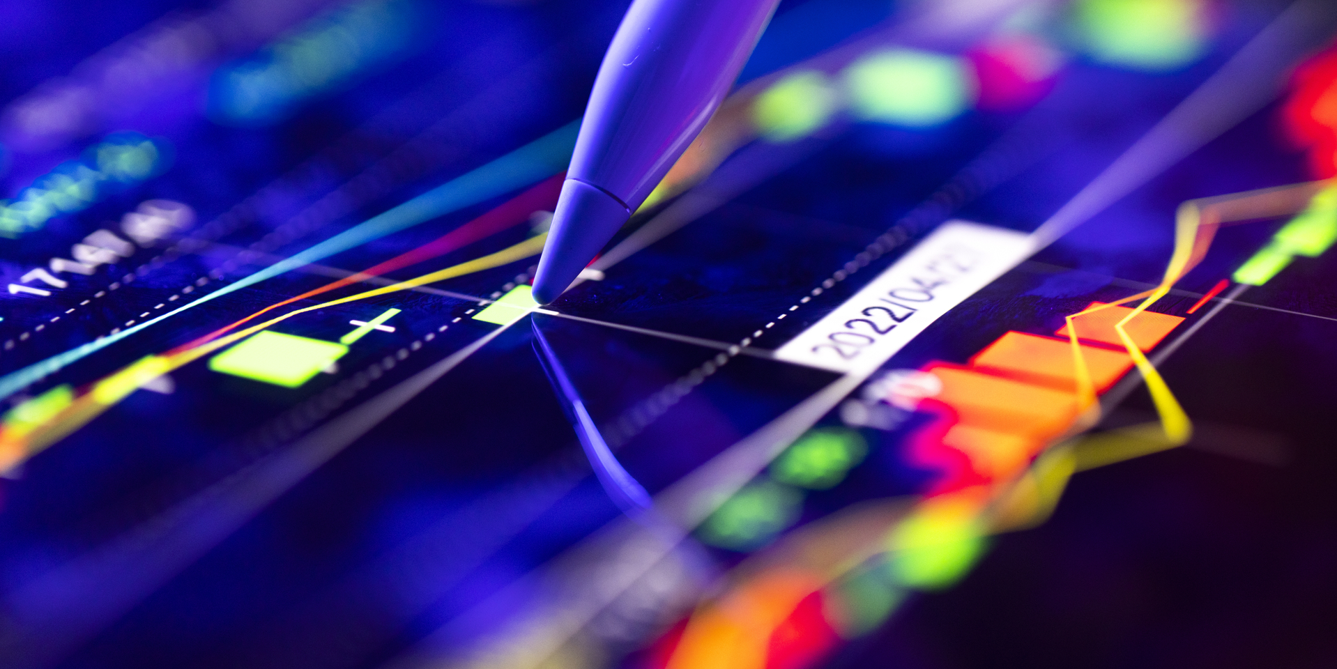 Person analyzing the market trends on a digital screen