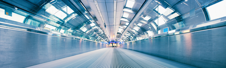 Futuristic Airport Walkway connecting different terminals in modern airport.