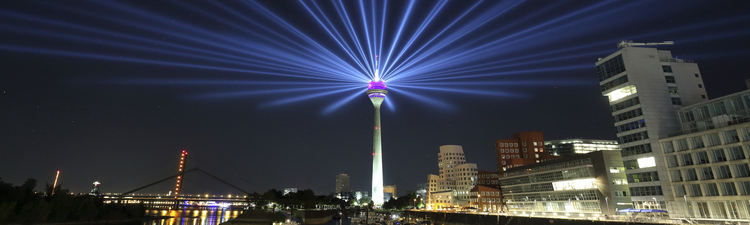 Duesseldorf, Germany - August 24, 2016: Duesseldorf media harbor panorama with illuminated Rheinturm tower.