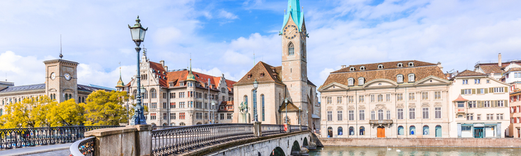 Zurich, Switzerland. View of the historic city center with famous Fraumunster Church, on the Limmat river.