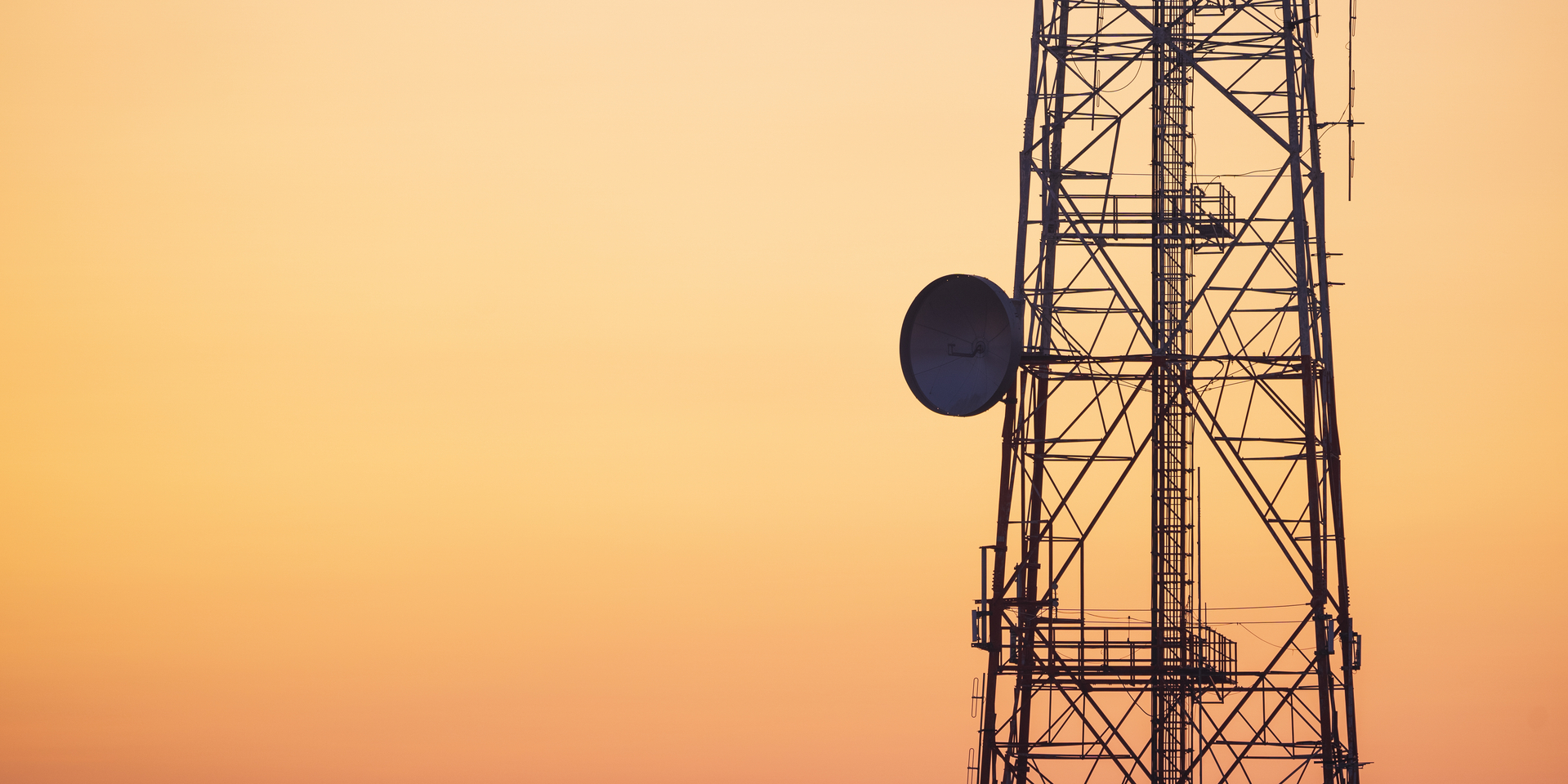 Silhouette of communication tower for broadcasting during sunrise time.