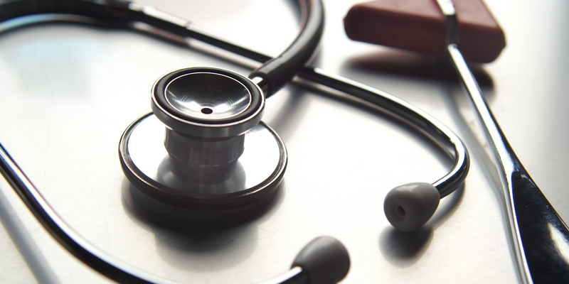 Close-up of stethoscope and reflex hammer.
