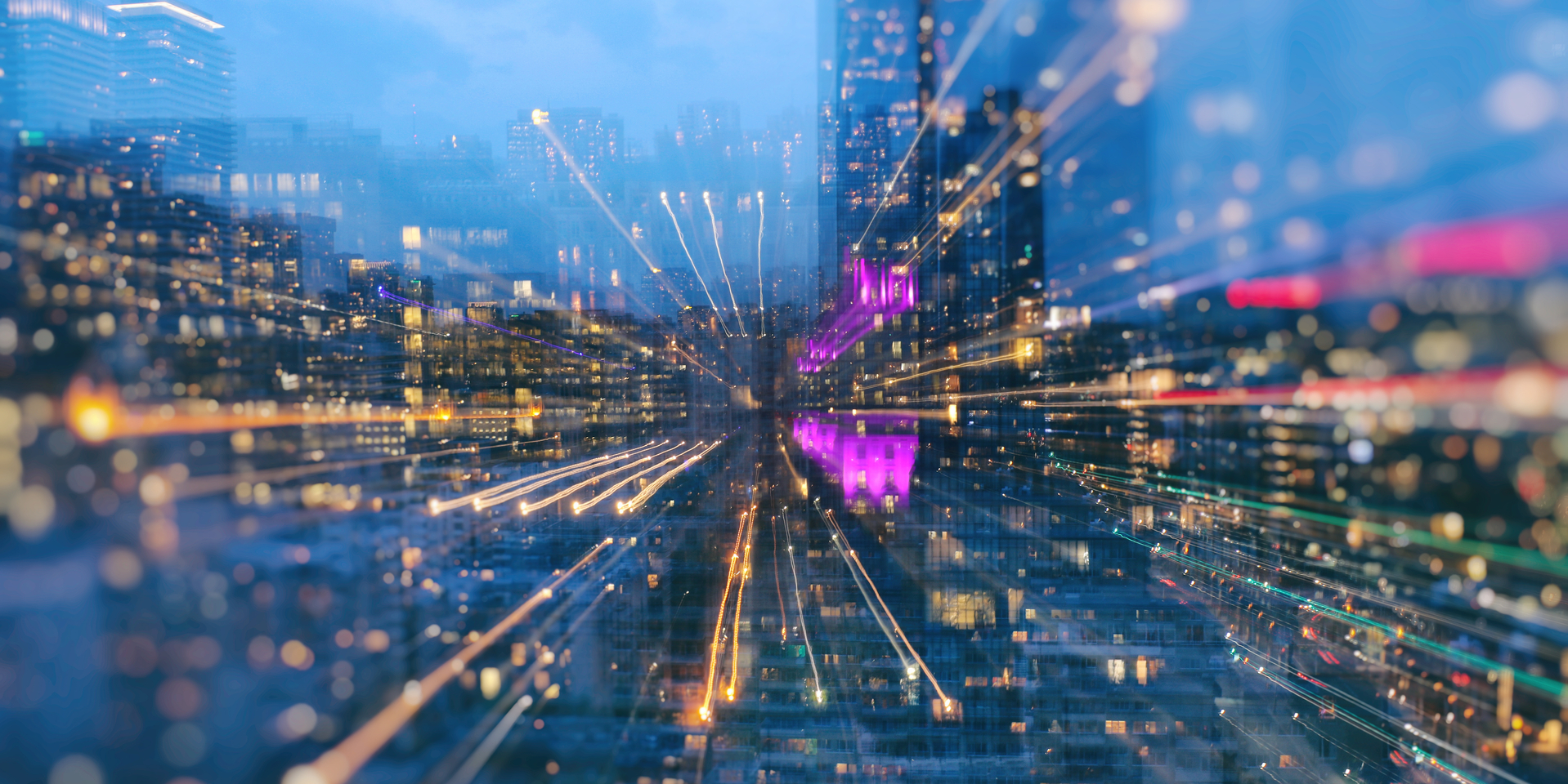 Toronto cityscape during a blue hour using long exposure, zooming in bokeh mode.